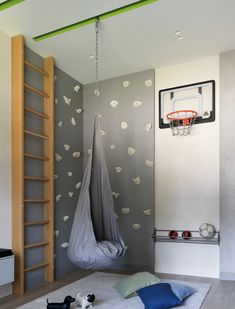 a room with a basketball hoop and some toys on the floor