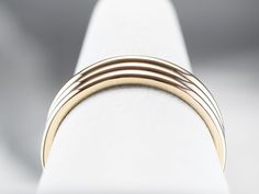 This vintage band is classic with a twist! A triple row design of 14 karat gold shines with a perfect polish and gives the effect of stacked bands. This ring is versatile and allows you to wear it as a wedding band, or simply an everyday ring! Metal: 14K Yellow Gold Width of Band: 6 mm Height off Finger: 1.5 mm Ring Size: 8.25 Marks: "14K" Stamped on the inside band Elegant Stackable Thick Bands, Classic Double Band Promise Ring, Timeless Stackable Double Band Rings, Stackable 14k Gold Wide Band, Stackable Wide Band In 14k Gold, Stackable Wide Band 14k Gold Bands, Wide Band Stackable 14k Gold Bands, Classic Wide Band Stackable Bands, Classic White Gold Double Band