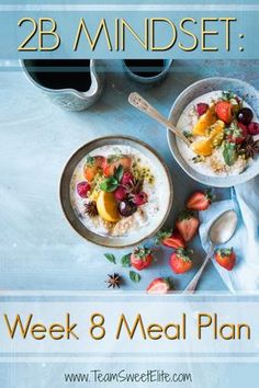 two bowls of oatmeal with strawberries and oranges on the side