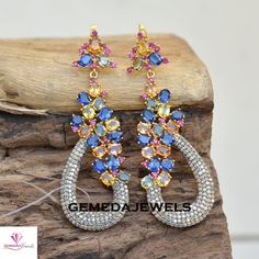 Genuine Multi Gemstone Earrings, Pave Diamond Jewelry, Diamond Dangle Earrings, 925 Silver Gemstone Jewelry, Gold Plated Earrings, Gift Gross Weight: 21.90 gm Diamond Weight: 2.73 Cts Gemstone Weight: 17.74 Cts Earings Size: 70X23 MM NOTE:- All The Products Are Designed And Manufactured In My Workshop By Me & My Team. Shown Products Are Purely Handmade. Custom Orders Are Open Handly Accepted. We Are the Perfect Choice For Any Custom Jewelry Manufacturing. For Bulk Orders Please Message me. Visit Fine Jewelry Multi-stone Drop Earrings, Multi-stone Cubic Zirconia Earrings For Anniversary, Multi-stone Cubic Zirconia Anniversary Earrings, Sterling Silver Multi-stone Earrings Fine Jewelry, Fine Jewelry Multi-stone Dangle Earrings, Sterling Silver Multi-stone Teardrop Earrings, Fine Jewelry Teardrop Multi-stone Earrings, Multi-stone Dangle Earrings For Party, Multi-stone Drop Earrings For Anniversary