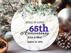 a marble ornament with the words still in love 65th anniversary written on it