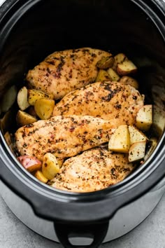 chicken and potatoes in the crock pot ready to be cooked or put into the slow cooker