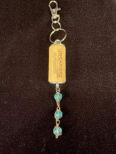 a key chain with some beads attached to it