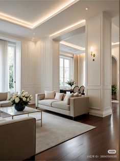 a living room filled with furniture and white walls