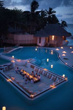 an image of a pool with candles on it