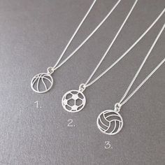 fine necklace with basketball/football/volleyball pendant (your choice) on a curb chain material: 925/1000 silver chain width: 1 mm pendant diameter: 1.2 cm 3 lengths to choose from: *40cm(=15.7") *45cm(=17.7") *50cm(=19.7") average weight: 1.75 gr hallmarked item shipping within 24 hours Volleyball Necklace, Basketball Necklace, Average Weight, Girly Accessories, Volleyball, Baskets, Silver Chain, Basketball, Jewelry Necklace Pendant