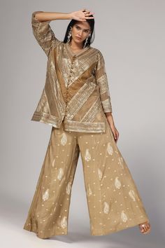 Khaki gold jacket with sequin and beads embroidery in geometric pattern. Paired with paisley embroidered wide legged pant. - Aza Fashions Eid Sharara With Gold Embroidery, Gold Long Sleeve Anarkali Set With Mirror Work, Gold Long Sleeve Anarkali Set With Gold Embroidery, Festive Wide-leg Sets For Diwali, Gold Embroidered Long Sleeve Anarkali Set, Festive Anarkali Set With Wide Leg, Traditional Wide-leg Pant Set For Festive Occasions, Traditional Wide Leg Pant Set For Festive Occasions, Festive Resham Embroidery Wide Leg Sets