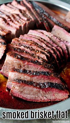 sliced meat on a plate with the words smoked brisket flat