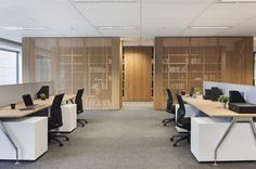 an empty office with desks and chairs