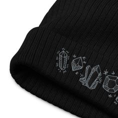 Stay warm while looking cool during the chilly weather! This hat features an embroidery of crystals stitched in grey and black thread on a black eco-friendly recycled ribbed beanie. Thanks to its breathable lightweight fabric, you can wear it both indoors and outdoors. These are made to order by our partner embroidery shop and will ship directly from them to save time and expense. If you order more than one item from my shop this may arrive separately. ► 50% recycled polyester and 50% acrylic ► Boho Beanie, Gold Tissue Paper, Cute Beanies, Embroidered Beanie, Beanie Black, Cuffed Beanie, Embroidery Shop, Black Thread, Winter Hats For Women