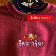 "*SIZES ARE UNISEX* -I'd suggest your usual size for a regular fit, or sizing up for a more relaxed fit. *these sweatshirts are extra comfy when oversized ☕️ \"Spice Girl\" embroidered on a cozy cute fall crewneck. Perfect for all the pumpkin spice lovers! A sturdy and warm sweatshirt bound to keep you warm in the colder months. A pre-shrunk, classic fit sweater that's made with air-jet spun yarn for a soft feel and reduced pilling. Your new favorite sweatshirt! * 50% cotton, 50% polyester * Pre Long Sleeve T-shirt With Embroidered Graphics For Fall, Fall Fleece Tops With Letter Embroidery, Cute Fleece Tops For Fall, Long Sleeve Fleece T-shirt For Fall, Fall Fleece Sweater With Embroidered Text, Fleece Sweatshirt With Letter Embroidery For Fall, Fleece Sweater With Letter Embroidery For Fall, Fall Embroidered Text Fleece Sweater, Winter Long Sleeve T-shirt With Embroidered Text