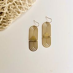 Brass Earrings, No. 46 These modern, bold statement earrings are perfect for any occasion. They are great for work but can also be dressed up to make a big impact that completes your look! + Super light weight, making them comfortable to wear all day long. + Hooks are gold fill. Great for even sensitive earrings. + Brass oxidizes over time, meaning it will change the more you wear it to give it that beautiful aged look. You can also polish them to their original shine very easily with many home Geometric Arch, Boho Arch, Time Meaning, Crescent Moon Jewelry, Arch Earrings, The Mundane, Bag Display, Upcycled Jewelry, Moon Jewelry