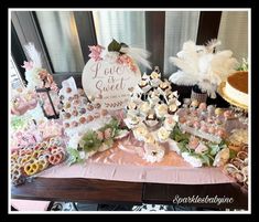 a table filled with lots of desserts and pastries