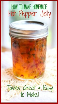 a jar filled with hot pepper jelly sitting on top of a white table next to a red frame