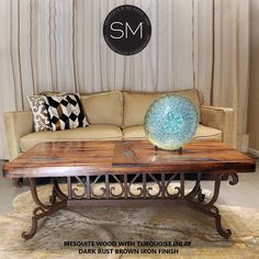 a couch and table in front of a curtained window with the words sm on it