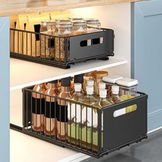 an organized kitchen drawer with spices and condiments on the bottom shelf in black