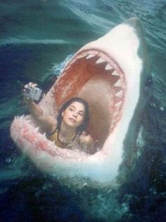 a woman in a shark boat with her mouth open