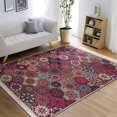 a living room with a couch and rug on the floor