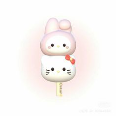 two hello kitty lollipops are sitting on top of each other