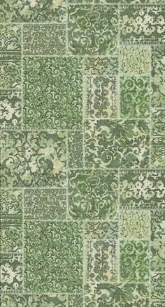 a green and white rug with many different designs on the carpet, including squares and rectangles