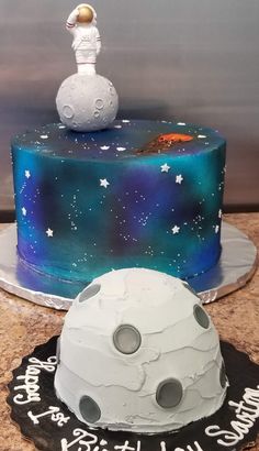 a birthday cake with an astronaut on top