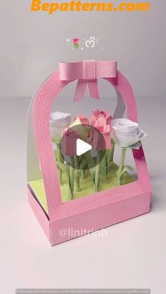 an origami box with flowers in it and a bow on the top that says bepatterns com