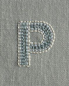 the letter p is stitched into fabric