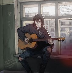 a man sitting on a window sill holding a guitar