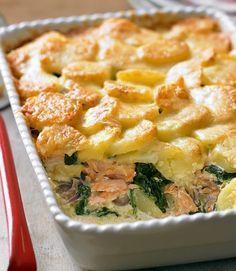 a casserole dish with potatoes and spinach