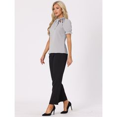 This regular-fit blouse will complement many body types to keep you looking great all day. The soft woven poly shapes a gathered neck, straight-cut silhouette, framed by puffy short sleeves with elastic cuff. Your wardrobe is not complete without this elegant office shirt. Pair it with high-waist pants and heels for an easy chic style. A sweet bow tie detail lends an elegant air to an everyday top. Stretch Puff Sleeve Blouse For Work, Elegant Stretch Puff Sleeve Top With Short Sleeves, Solid Padded Blouse For Work, Solid Color Padded Blouse For Work, Solid Stretch Blouse For Formal Wear, Formal Stretch Blouse, Elegant Puff Sleeve Tops For Business Casual, Stretch Blouse For Formal Occasions, Chic Stretch Puff Sleeve Top For Work