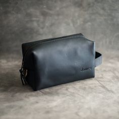 DOPP BAGPerfect for: Groomsmen gifts Mens leather travel bag Dopp kit / leather toiletry bag Gift for Him Gift for Guys Handmade with full grain cowhide right here in the U.S.! Our Dopp Kits feature a simple and classic design. A zippered top keeps your toiletries secure, and the minimalist interior provides easy access for all your daily essentials. Strong, durable, and beautiful, the leather used to make this product is the same used in making boots, saddles, and all manner of made-to-last, al Gift For Guys, Leather Dopp Kit, Leather Toiletry Bag, Leather Travel Bag, Groomsmen Gifts, Dopp Kit, Mens Leather, Leather Travel, Minimalist Interior