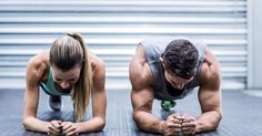 two people doing push ups on the floor