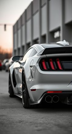 the rear end of a white sports car