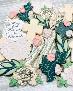 decorated cookies are arranged on a table