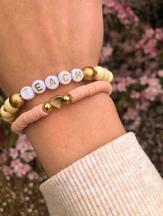 The Boho Teacher stack is perfect for the everyday teacher. This stack is cute, casual, and right on-trend. It includes a wooden beaded TEACH bracelet and a pink "heart of a teacher" bracelet featuring a metal heart charm in the middle. Buy this bracelet for yourself, a friend/family member, or any other amazing teacher in your life! This stack is that perfect reminder of how truly special teachers are. Casual Beaded Bracelets With Heart Charm, Casual Heart-shaped Beaded Bracelets For Everyday, Boho Teacher, Teacher Bracelet, Teacher And Student, Gift Crafts, Artsy Gift, Metal Heart, Matching Bracelets