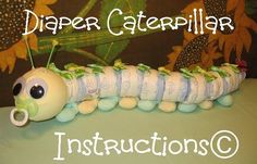 a stuffed caterpillar sitting on top of a table