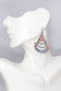 Elevate your spring and summer style with these stunning hand-beaded hypoallergenic stainless steel silver hoops adorned with beautiful seed bead flowers in a delightful array of shades including pink, mauve, purple, blue, teal, and aqua. Choose from three sizes to suit your preference - small (1 inch wide), medium (1.5 inches wide), or large (1 7/8 inches wide). These earrings are also available in a teardrop shape (1 1/8 inches wide) complete with a charming Czech flower dangle. Add a pop of c Bohemian Jewelry With Dangling Beads For Spring, Bohemian Beaded Flower Earrings For Spring, Bohemian Spring Jewelry With Dangling Beads, Spring Bohemian Beaded Flower Earrings, Spring Jewelry With Dangling Beads, Spring Multicolor Teardrop Jewelry, Bohemian Hypoallergenic Beaded Earrings For Summer, Bead Flowers, Seed Bead Flowers