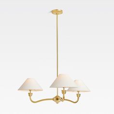 three light brass chandelier with white shades