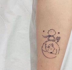 a small tattoo on the arm of a person with a dog and flower in it