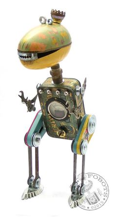 an old fashioned robot is standing with its head turned to look like it's holding something