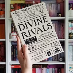 a person holding up a book in front of a bookshelf full of books