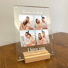 a clear acrylic photo frame with four photos on it and the words i love you