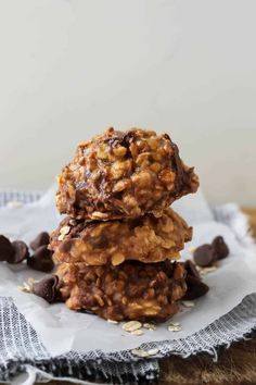 three cookies stacked on top of each other with chocolate chips and oatmeal