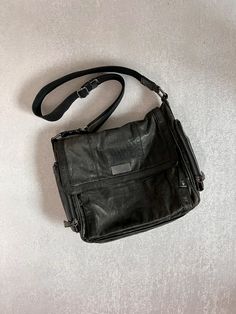 "Fabulous Francesco Biasia distressed leather crossbody bag. Various pockets make storing all your bits and baubles a breeze in this medium/large bag. It measures about 14.5\" wide x 11.5\" tall x 6.5\" deep, all measurements taken flat. It is in good vintage condition, the signs of wear enhancing the distressed look.  This item has not been professionally cleaned but exterior has been wiped down and interior has been brushed out and cleaned. The condition is good with overall wear to the exterior and and shoulder strap and light wear to the interior. PLEASE NOTE: A thorough inspection is made of all items, however, being vintage there will be general wear and some flaws might unintentionally get missed. Also, while every attempt is made to photograph in the most natural light possible, th Distressed Leather Bag, Long Silk Scarf, Alpaca Sweater, Beautiful Sweater, Distressed Leather, Large Bag, The Signs, Large Black, Leather Crossbody Bag