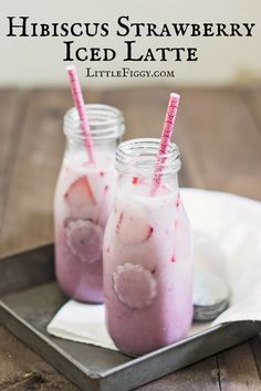 two glasses filled with ice cream sitting on top of a tray