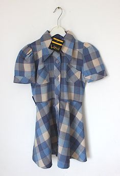 "FRENCH VINTAGE 70's, stunning plaid belted dress, midweight Tergal fabric ( polyester blend ), blue colors, wide pointed collar, breast pockets, buttoned on the front,  belt to tie, made in Belgium. Estimated size 6 years Length 23,2\" / Underarms 13,4\"  Vintage condition level 5, new old stock ( belt is messing and can be easily replaced ) We assess the condition of our vintage items on a scale from 0 to 5. Level 5 corresponds to an almost new vintage condition. Any defects are systematically Fitted Retro Plaid Dress For Fall, Fitted Vintage Plaid Dress, Vintage Plaid Short Sleeve Dress, Vintage Plaid Dress For Work, Fitted Plaid Collared Dress, Collared Fitted Plaid Dress, Fitted Collared Plaid Dress For Fall, Fitted Collared Plaid Dress, Retro Plaid Mini Dress