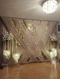 an elegant wedding setup with chandeliers and flower centerpieces on the dance floor