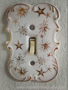 a decorative light switch cover with stars on it