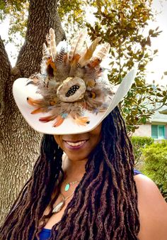 A beautiful display of western elegance - our authentic beige cowboy hat is handcrafted and combines rugged charm with high-fashion flair, making it the perfect accessory for anyone looking to make a statement.  The crystal feather brooch is detachable.   Impeccable Craftsmanship: Meticulously crafted from high-quality felt, this cowboy hat exudes sophistication and authenticity. The attention to detail in its design is simply unparalleled. The handcrafted feather brooch makes this hat is truly Handmade Hat Bands For Kentucky Derby, Handmade Western Costume Hats For Kentucky Derby, Western Beige Hat Bands For Kentucky Derby, Handmade Western Hats For Kentucky Derby, Artisan White Hat Bands For Western-themed Events, Artisan Hat Bands For Kentucky Derby, Bohemian Beige Hat Band For Western-themed Events, Handmade Western Costume Hats And Headpieces For Rodeo, Handmade Western Costume Hats And Headpieces For Western-themed Events