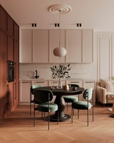 a dining room table surrounded by chairs and cupboards